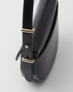 Prada Arqué flip leather shoulder bag