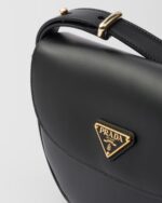 Prada Arqué flip leather shoulder bag